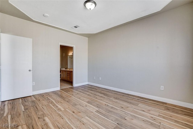 unfurnished room featuring light wood-type flooring