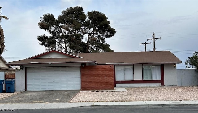 ranch-style home featuring a garage