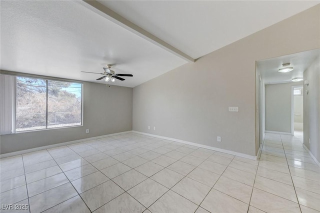 spare room with beamed ceiling, ceiling fan, and light tile patterned floors