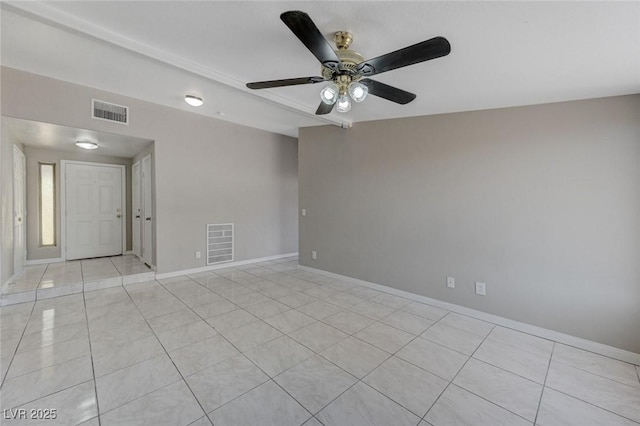 tiled spare room with vaulted ceiling and ceiling fan