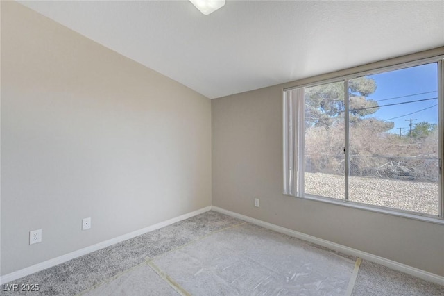 empty room featuring light carpet