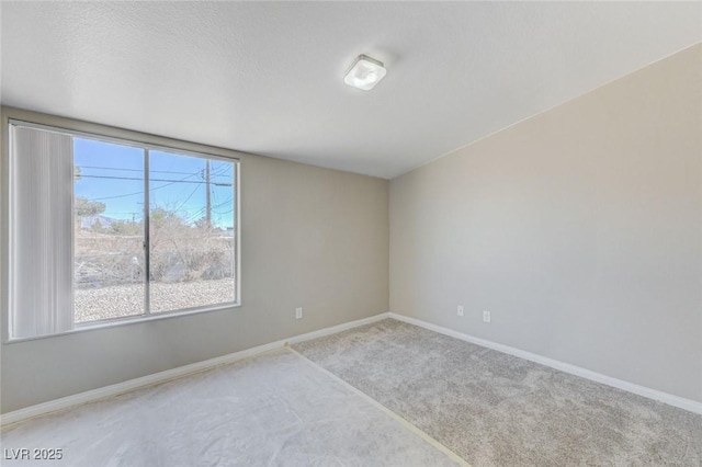 empty room with light colored carpet