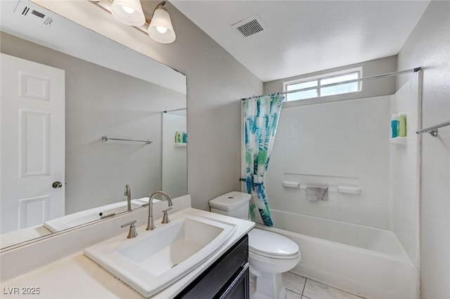 full bathroom with vanity, shower / tub combo with curtain, tile patterned floors, and toilet