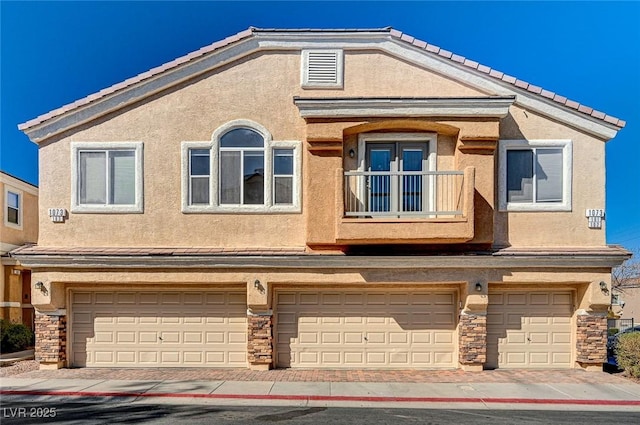 multi unit property featuring a garage