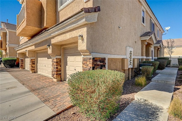 view of property exterior with a garage