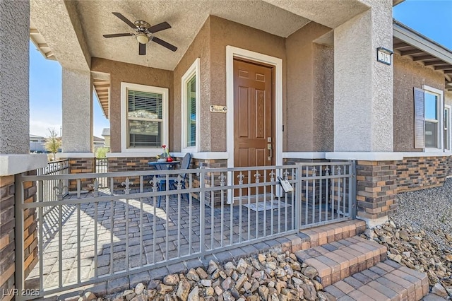 property entrance featuring ceiling fan