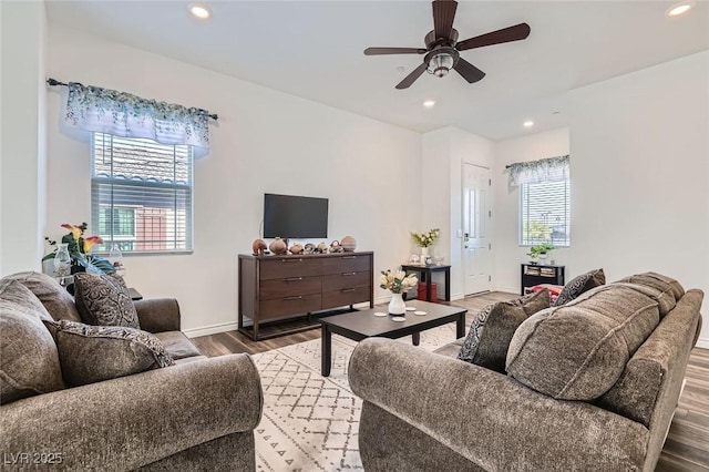 living room with hardwood / wood-style flooring and ceiling fan