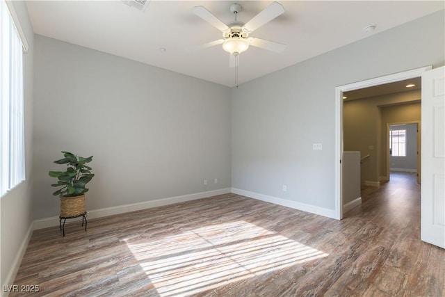 spare room featuring hardwood / wood-style floors and ceiling fan