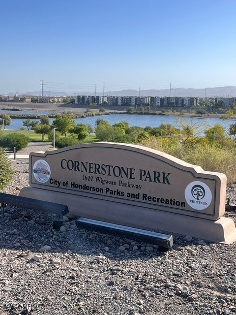 community sign with a water view