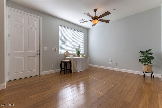 unfurnished room featuring wood-type flooring and ceiling fan