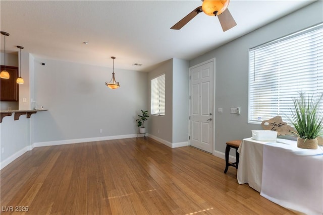 interior space featuring hardwood / wood-style flooring and ceiling fan