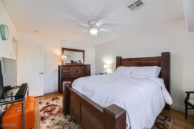 bedroom featuring ceiling fan and light hardwood / wood-style flooring