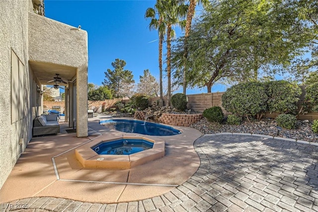 view of pool featuring an in ground hot tub, ceiling fan, and a patio