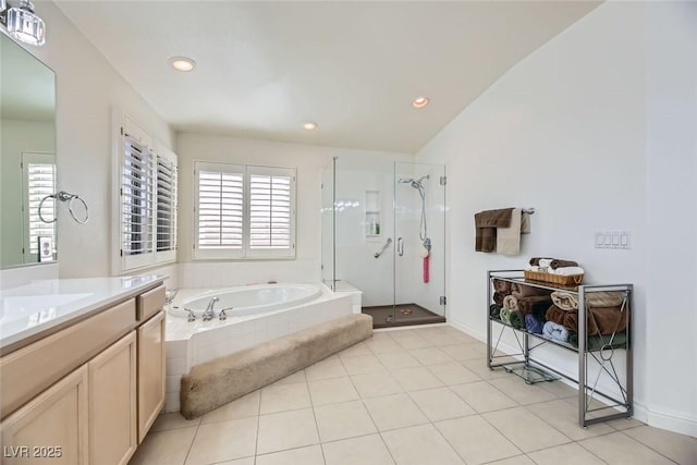 bathroom with vanity, tile patterned flooring, a wealth of natural light, and separate shower and tub