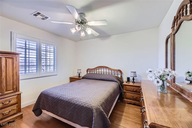 bedroom featuring ceiling fan and light wood-type flooring