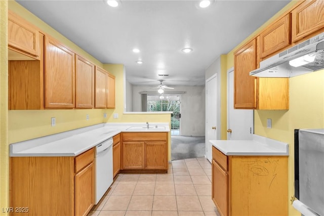 kitchen featuring dishwasher, sink, light tile patterned flooring, and ceiling fan