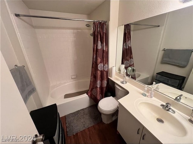 full bathroom with vanity, hardwood / wood-style flooring, shower / bath combination with curtain, and toilet