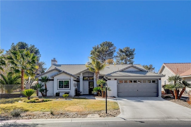 view of front facade with a garage and a front yard