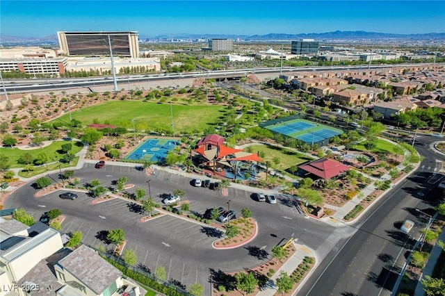 birds eye view of property with a mountain view