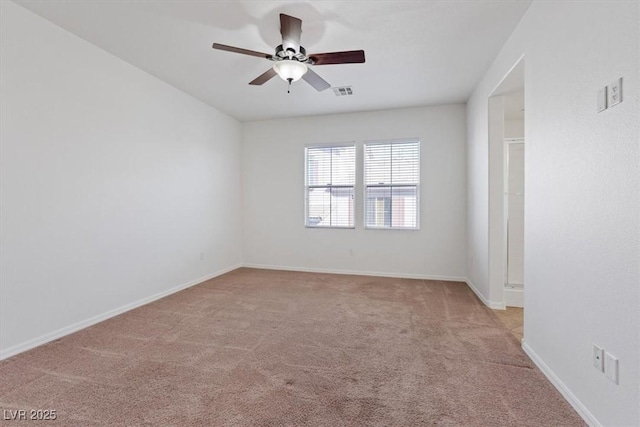 unfurnished room with ceiling fan and light colored carpet