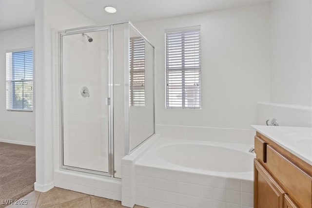 bathroom with vanity, independent shower and bath, and tile patterned flooring