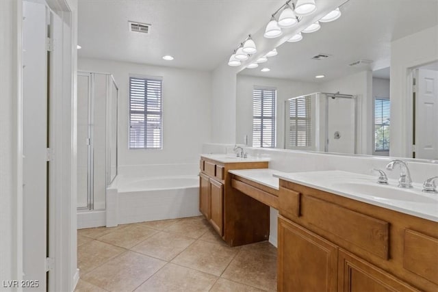 bathroom featuring tile patterned flooring, plus walk in shower, and vanity