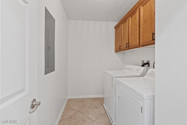 washroom featuring washer and clothes dryer and cabinets