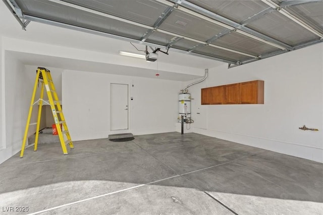 garage featuring a garage door opener and water heater