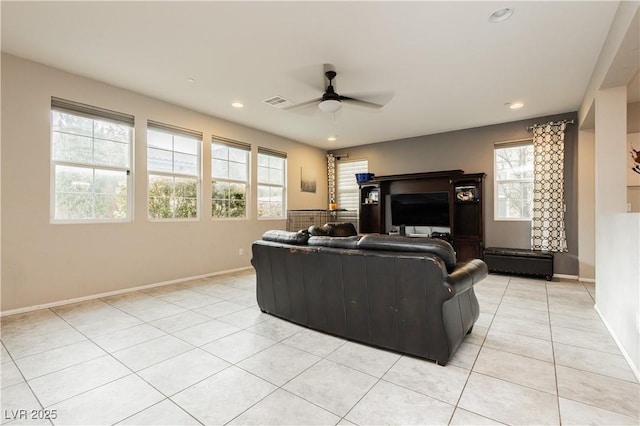 living room featuring light tile patterned floors and ceiling fan