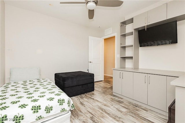 bedroom featuring ceiling fan and light wood-type flooring