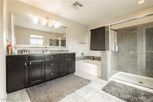 bathroom featuring tile patterned floors, separate shower and tub, and vanity