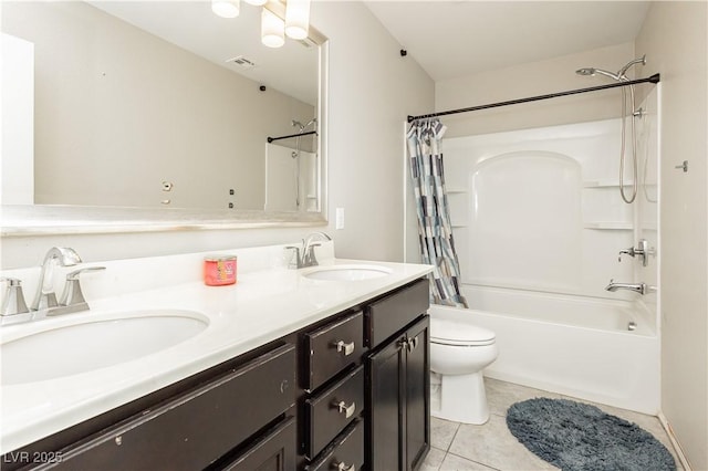 full bathroom with vanity, toilet, tile patterned flooring, and shower / bath combo with shower curtain