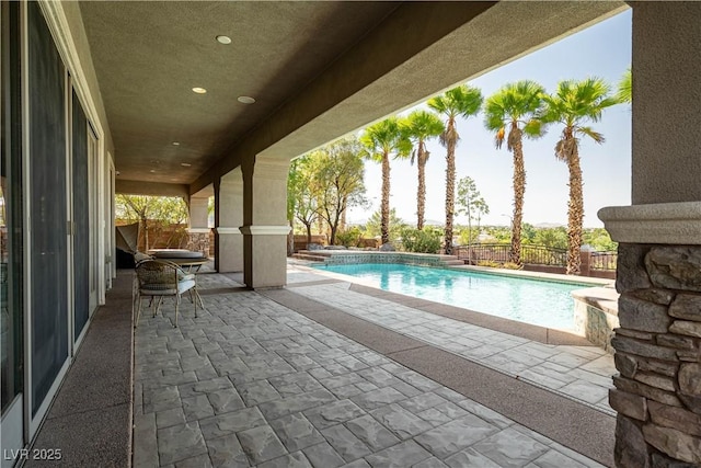 view of pool featuring a patio