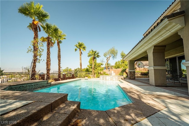 view of swimming pool with a patio area