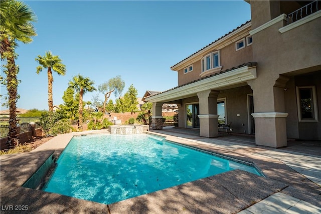 view of swimming pool featuring a patio