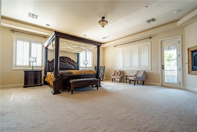 bedroom with light carpet and access to exterior