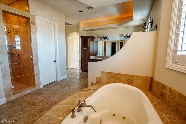 bathroom with vanity and plus walk in shower