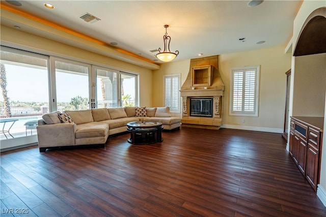 living room featuring dark hardwood / wood-style floors and a fireplace