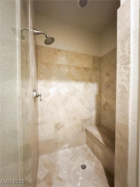 bathroom featuring tiled shower