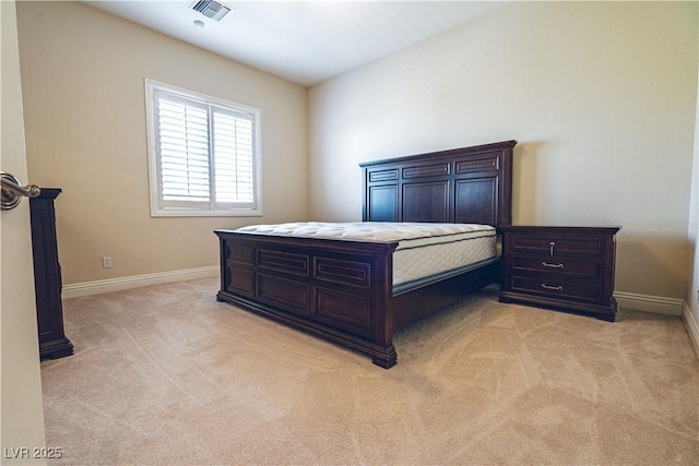 bedroom featuring light carpet