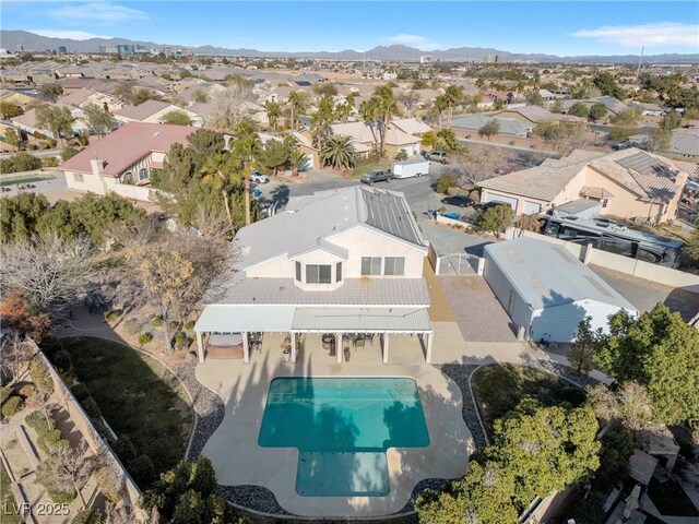 9435 Westwind Rd, Las Vegas, NV 89139 - aerial perspective of suburban area featuring a pool and mountains