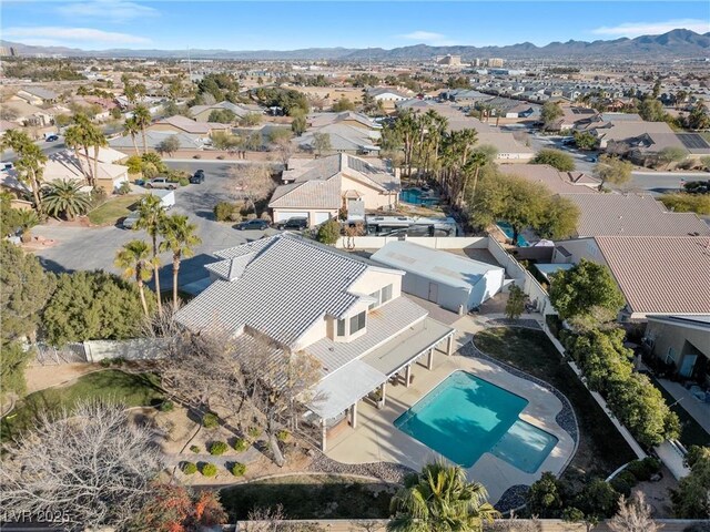 9435 Westwind Rd, Las Vegas, NV 89139 - aerial perspective of suburban area with a pool and a mountainous background