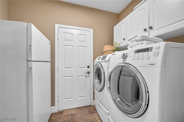 9435 Westwind Rd, Las Vegas, NV 89139 - clothes washing area with washer and dryer, cabinet space, stone finish flooring, and baseboards