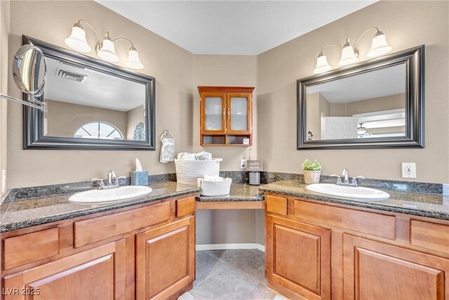 9435 Westwind Rd, Las Vegas, NV 89139 - full bathroom with two vanities and tile patterned floors