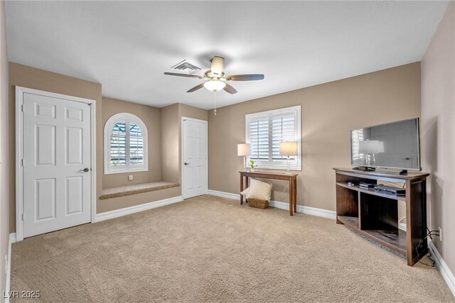 9435 Westwind Rd, Las Vegas, NV 89139 - living area featuring a ceiling fan, carpet floors, and baseboards