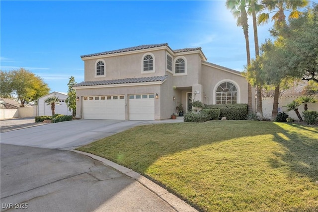 9435 Westwind Rd, Las Vegas, NV 89139 - mediterranean / spanish house with stucco siding, a garage, driveway, and a front yard