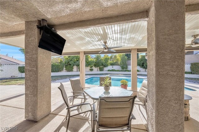 9435 Westwind Rd, Las Vegas, NV 89139 - view of patio featuring a ceiling fan, a fenced backyard, and outdoor dining space