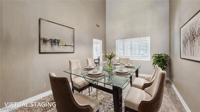 9435 Westwind Rd, Las Vegas, NV 89139 - dining area featuring baseboards and a high ceiling