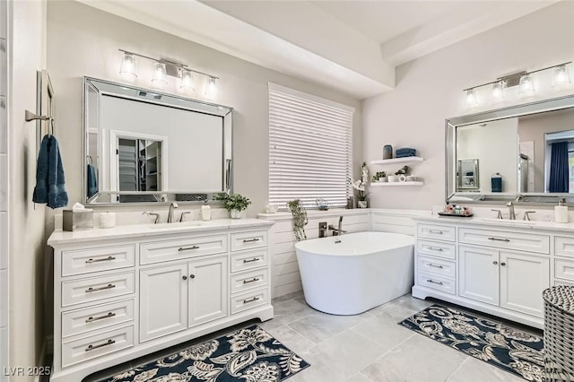 bathroom featuring vanity and a bathtub