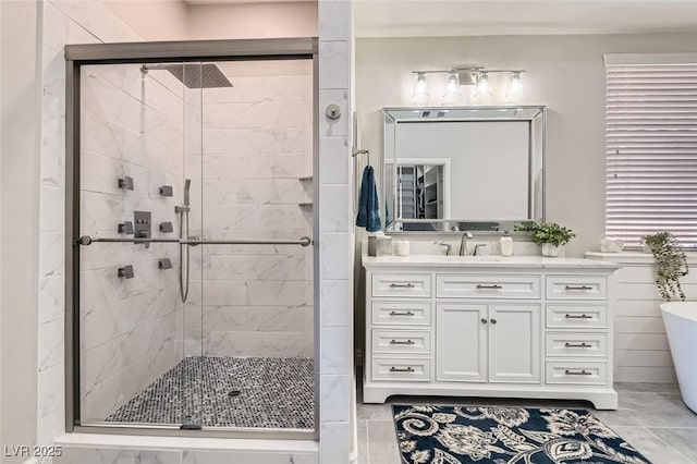 bathroom featuring vanity and shower with separate bathtub